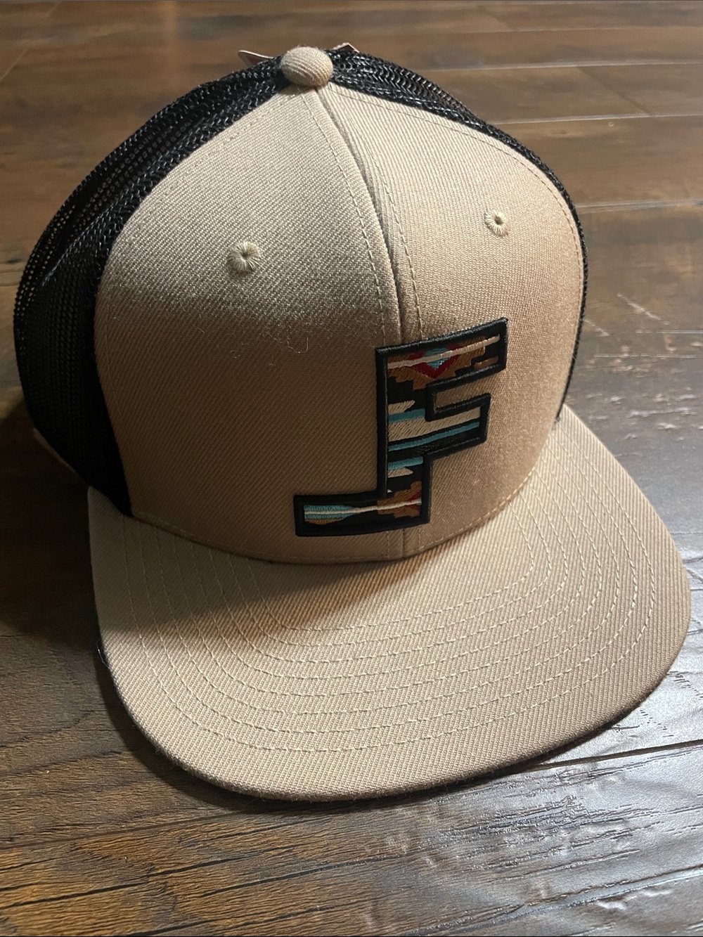Tan and Black Trucker Hat with Patterned 'F' Patch